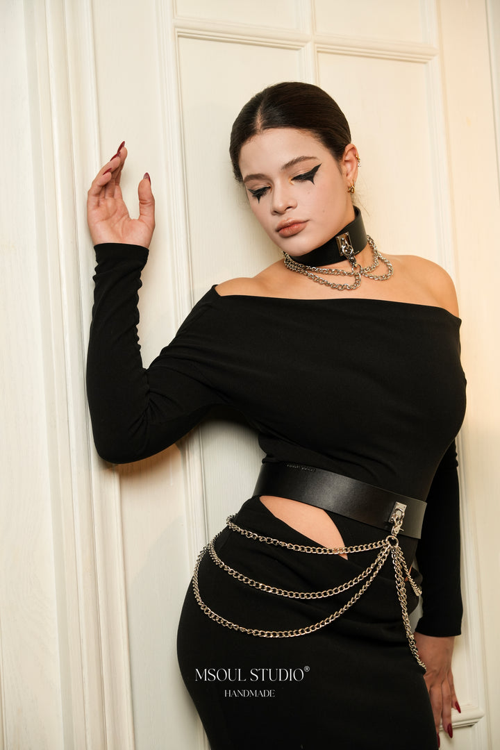 Model leaning on a white wall wearing the Cascade Set