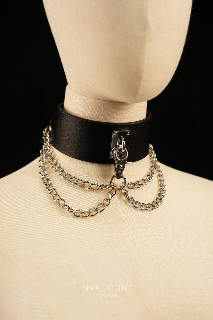 Cascade Collar on a mannequin with silver chains and clasp, front view