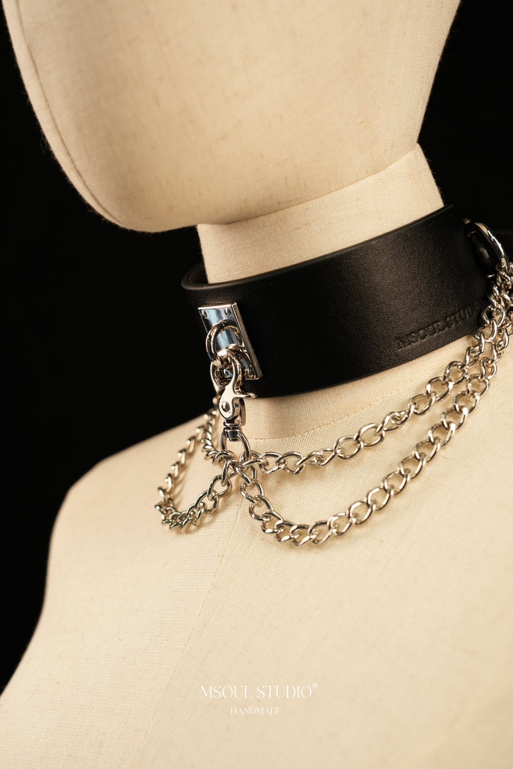 Angled view of the black leather Cascade Collar with silver chains
