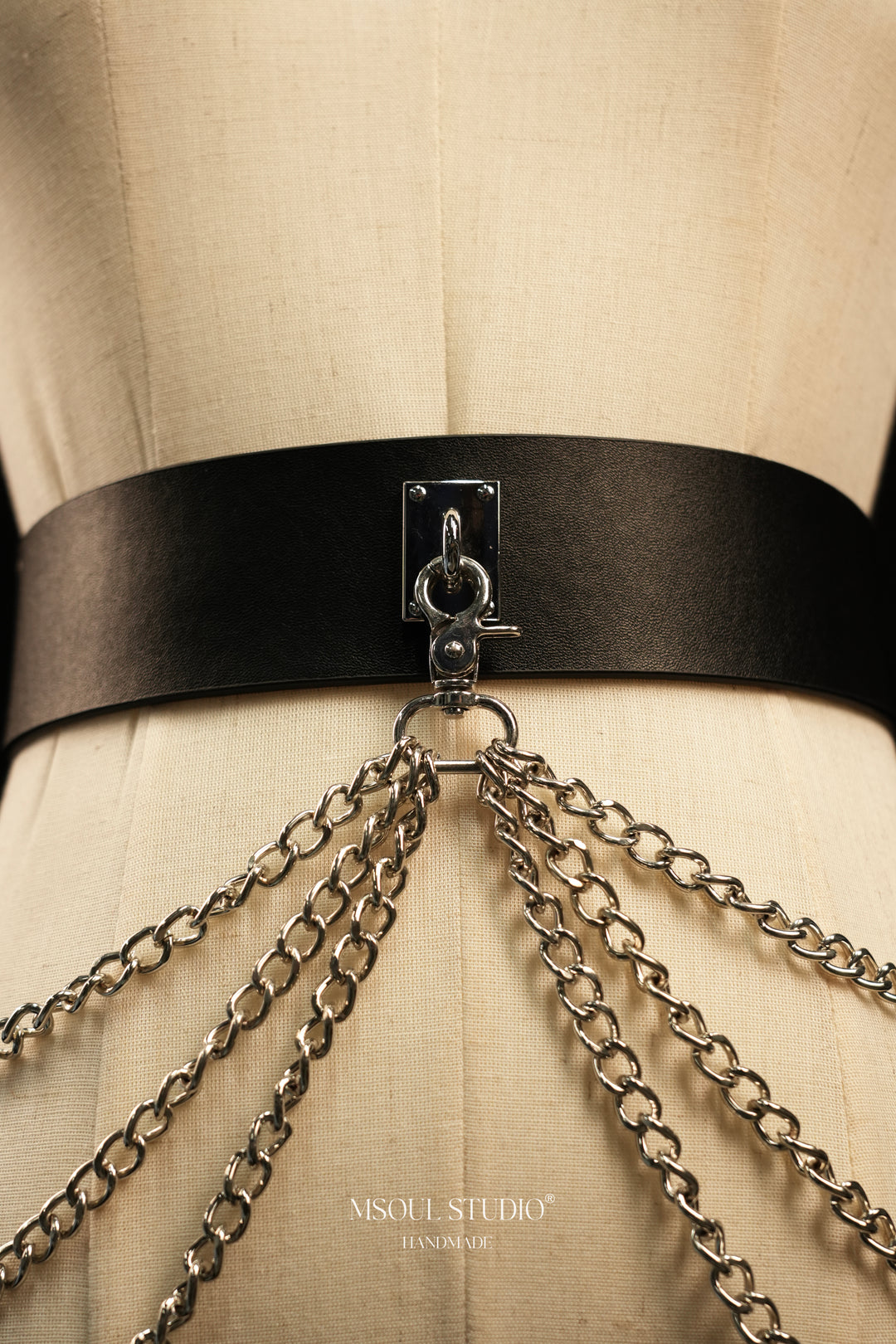 Front close-up of the black leather belt with silver chains
