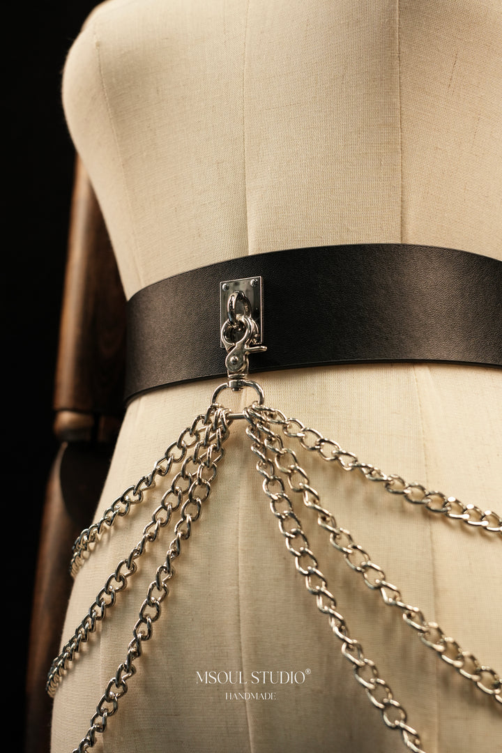 Silver chain drops from the clasp of the Cascade Chain Belt