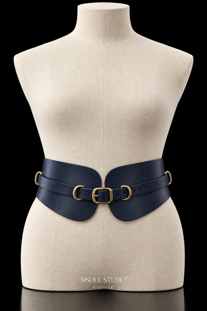 The Rein Waist Belt by MSOUL STUDIO, front view with overlay strap, brushed gold buckle closure and gold D-rings