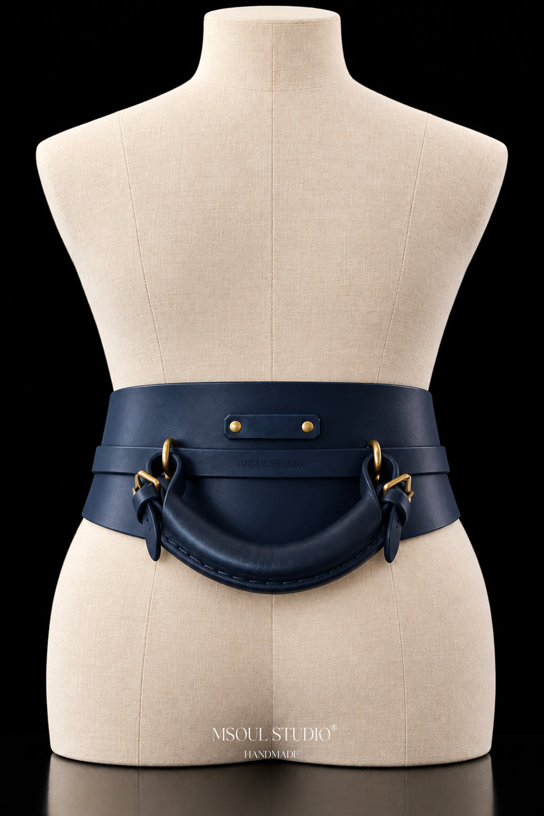 The Rein Waist Belt by MSOUL STUDIO, back view with detachable padded grab handle on gold rings and embossed MSOUL STUDIO strap